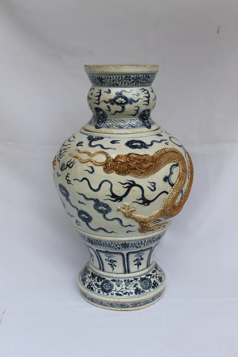 Front view of the vase showing an applied gilt-brown dragon coiling around the shoulder