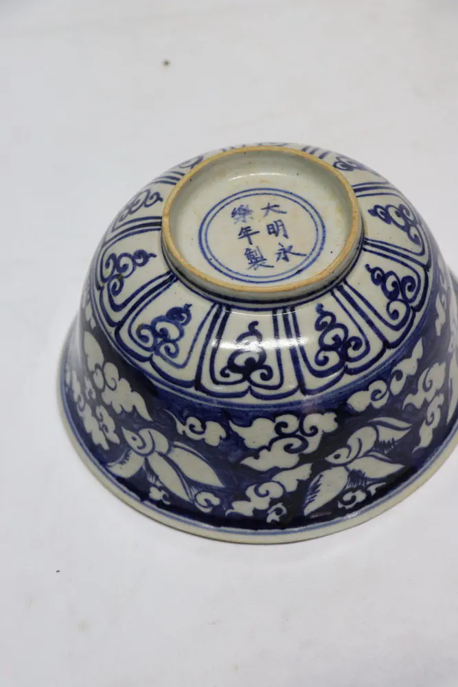 Base of the bowl showing the six-character Yongle reign mark in a double ring above a lotus panel band