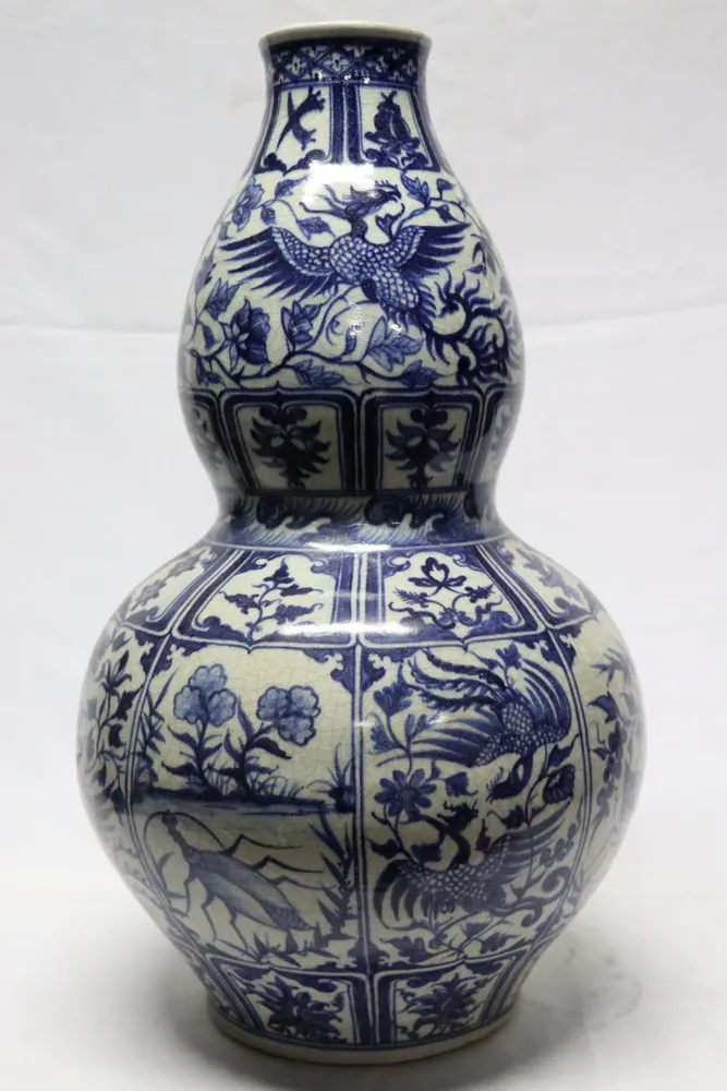 Blue and white double gourd vase with panelled phoenix and floral decoration, front view