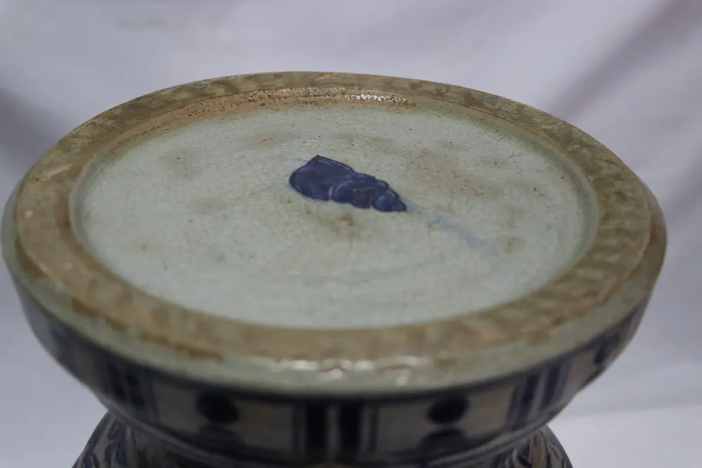 Base of the vase showing a small spiral shell mark painted in underglaze blue