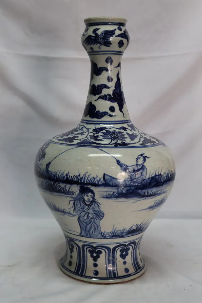 Bottle vase, front view, with a fisherman in a boat and a standing figure in a reed landscape