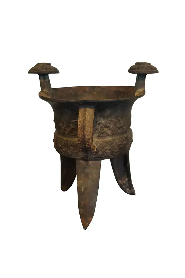 Bronze tripod vessel with two capped posts on the rim, bands of fret pattern and blade-shaped legs