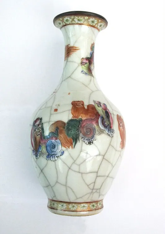 Crackle-glazed vase painted in coloured enamels with lions and brocade balls