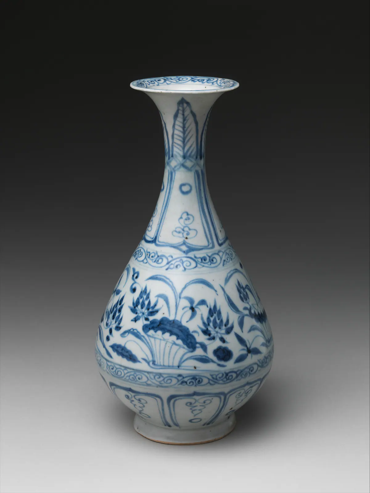 A pear-shaped Yuan blue and white bottle with a flared mouth, painted with plantain leaves on the neck, a lotus pond around the body and petal panels near the foot.