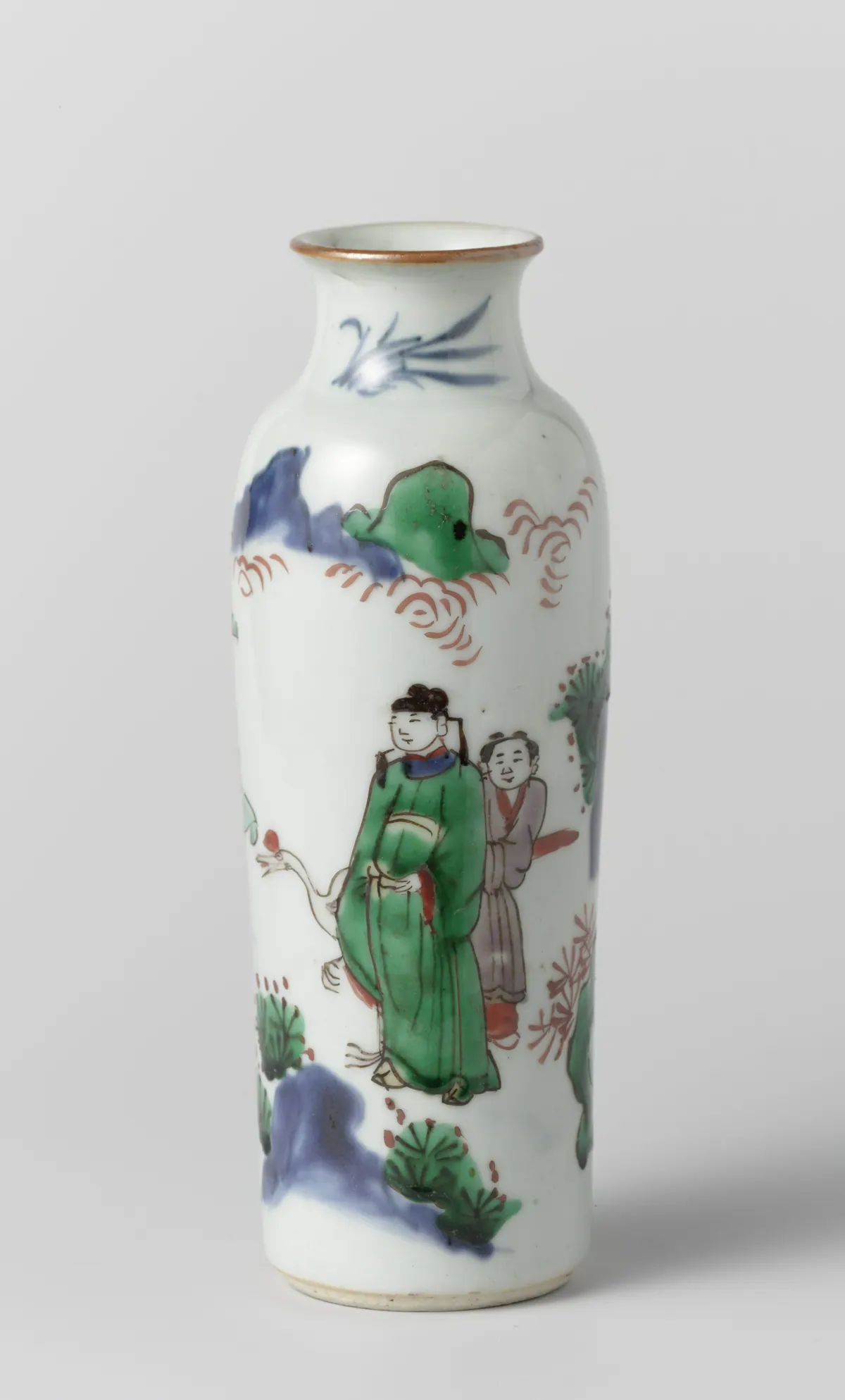 A small Transitional sleeve vase painted in green, red and aubergine enamels with underglaze blue, showing an official in a green robe, his servant and a red-crowned crane among rocks.