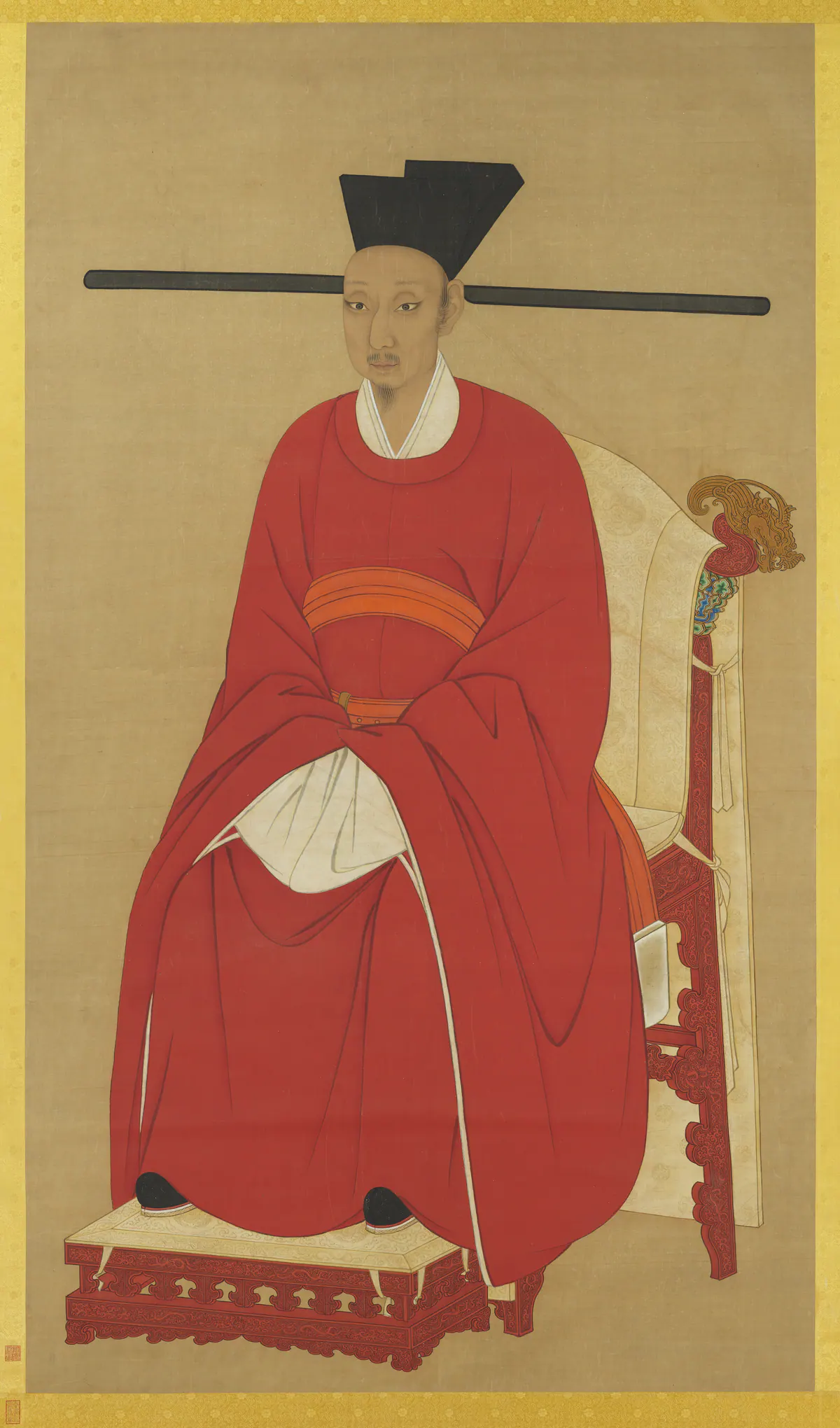 Seated court portrait of Emperor Ningzong of Song in a red robe and black winged hat on a carved chair
